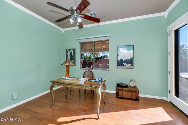 office area with ceiling fan, plenty of natural light, wood-type flooring, and ornamental molding