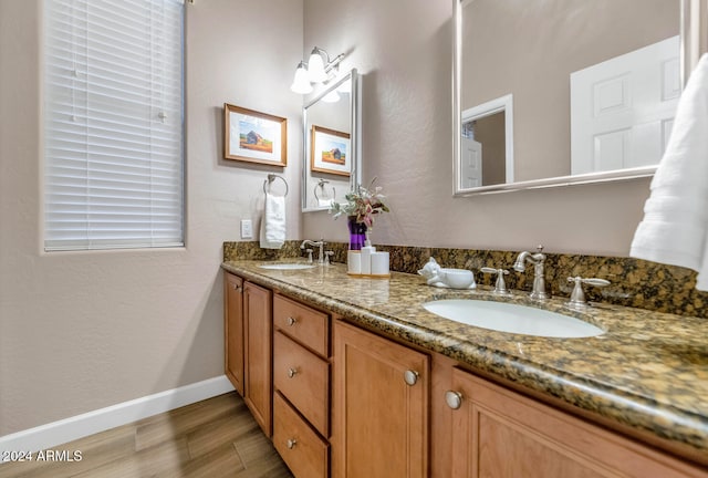 bathroom featuring hardwood / wood-style floors and vanity