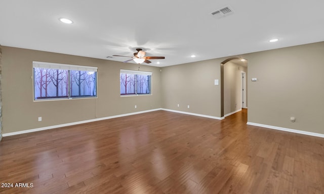 spare room with hardwood / wood-style floors and ceiling fan