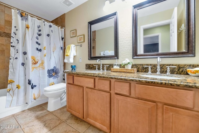 full bathroom featuring tile patterned flooring, shower / bath combination with curtain, vanity, and toilet