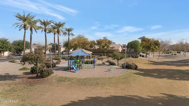 view of jungle gym featuring a lawn