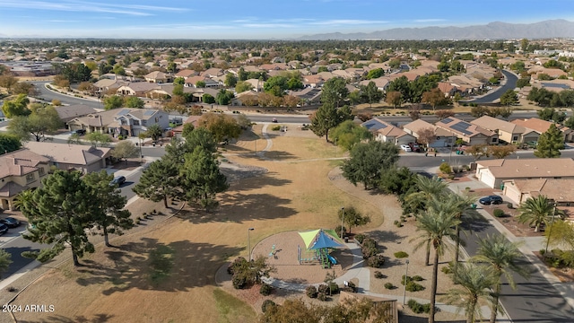 birds eye view of property with a mountain view