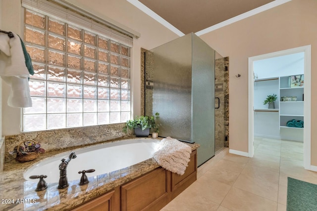 bathroom featuring tile patterned floors, crown molding, and independent shower and bath