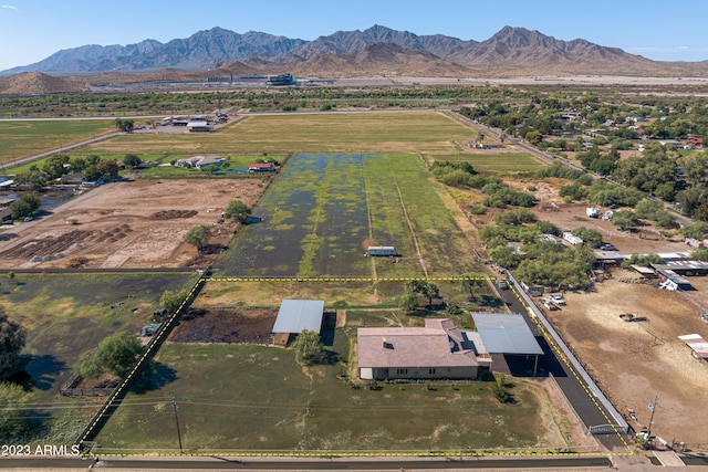 birds eye view of property with a mountain view