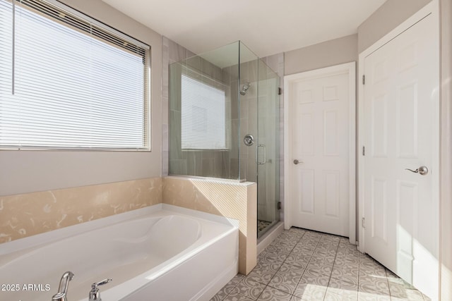 bathroom featuring tile patterned flooring and plus walk in shower