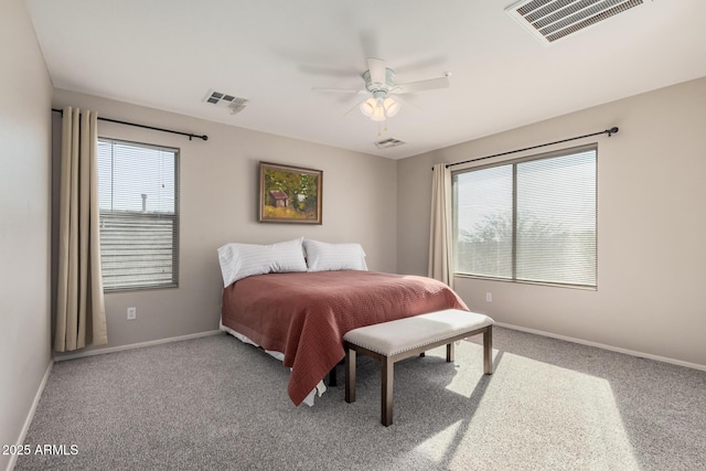 bedroom featuring carpet floors, visible vents, and baseboards