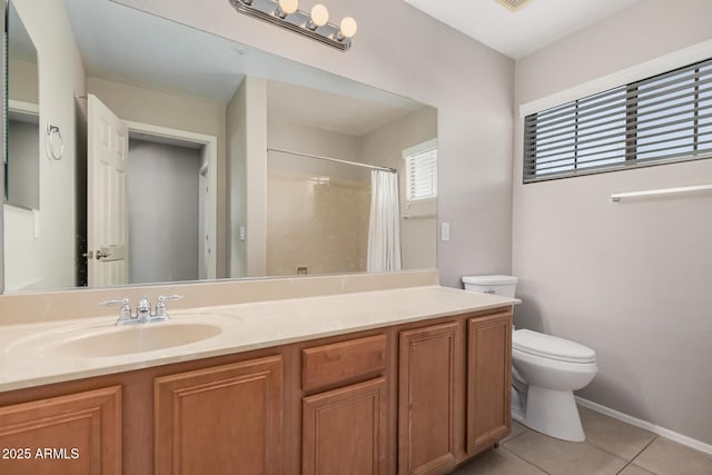 bathroom featuring a shower with shower curtain, vanity, tile patterned floors, and toilet