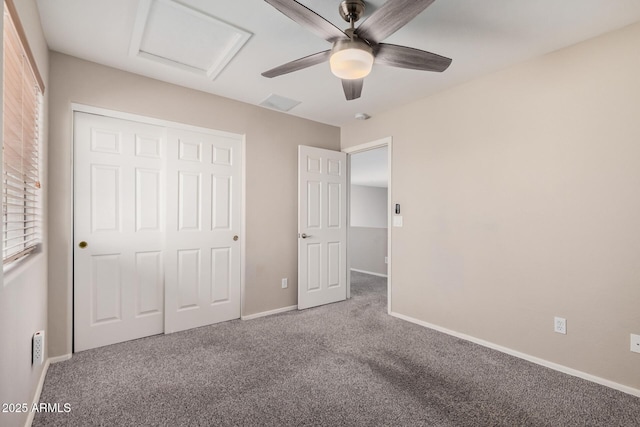 unfurnished bedroom featuring ceiling fan, a closet, and carpet flooring