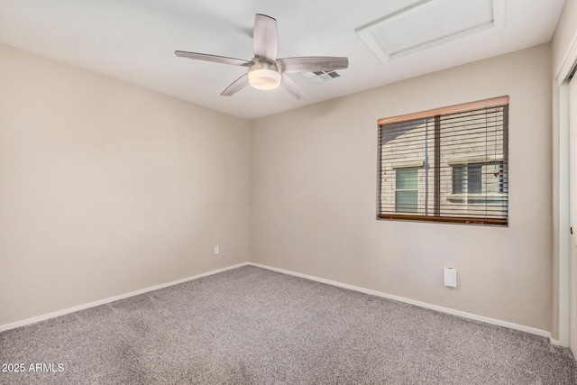 carpeted spare room featuring ceiling fan