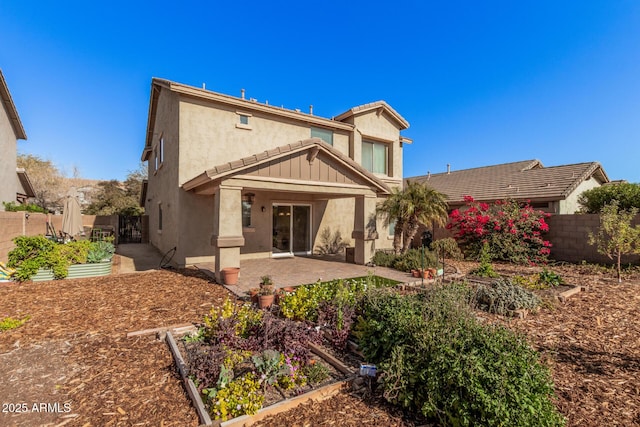 back of property with a patio area