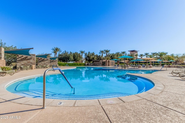 view of swimming pool featuring a patio area