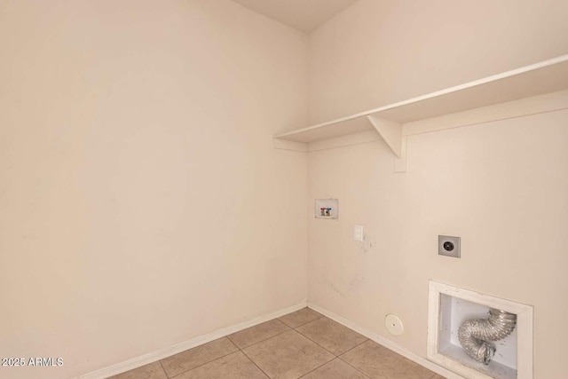 washroom with hookup for a gas dryer, light tile patterned floors, hookup for a washing machine, and hookup for an electric dryer