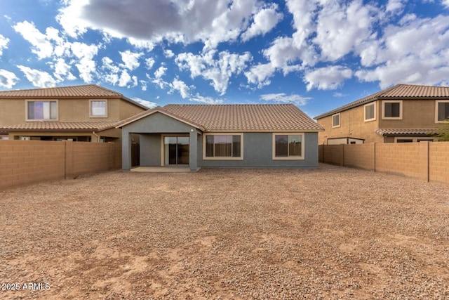 back of house with a patio