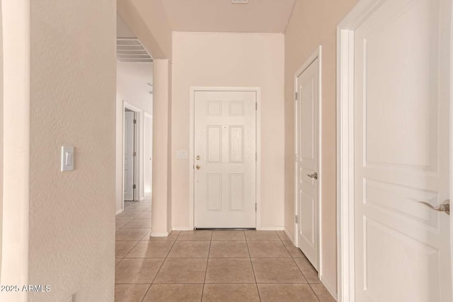 hallway featuring light tile patterned flooring