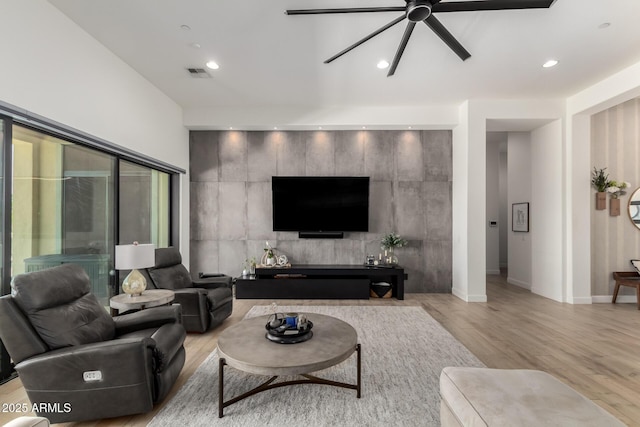 7002 S Portland Ave, Gilbert, AZ 85298 - living room featuring a ceiling fan, light wood-type flooring, recessed lighting, and baseboards