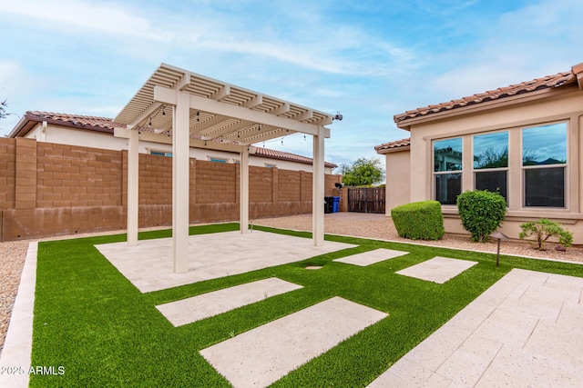 view of yard featuring a pergola, fence, and a patio area