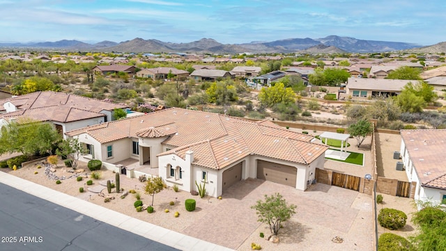 birds eye view of property featuring a mountain view and a residential view