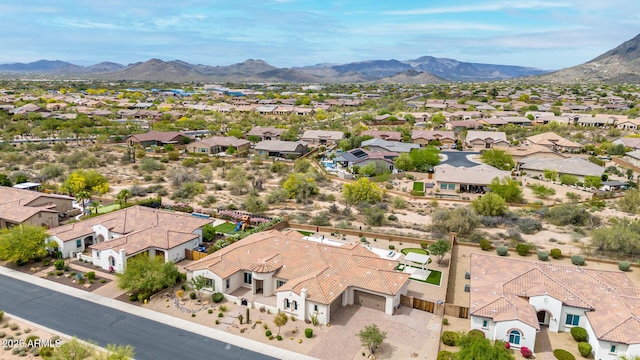 drone / aerial view featuring a residential view and a mountain view