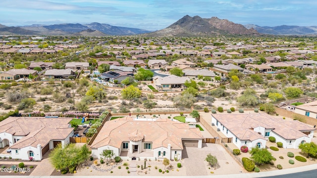 birds eye view of property with a residential view and a mountain view