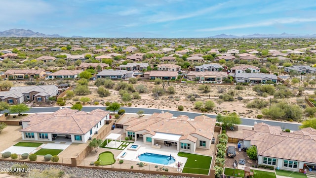 aerial view featuring a mountain view and a residential view