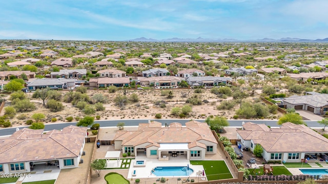 drone / aerial view featuring a residential view and a mountain view