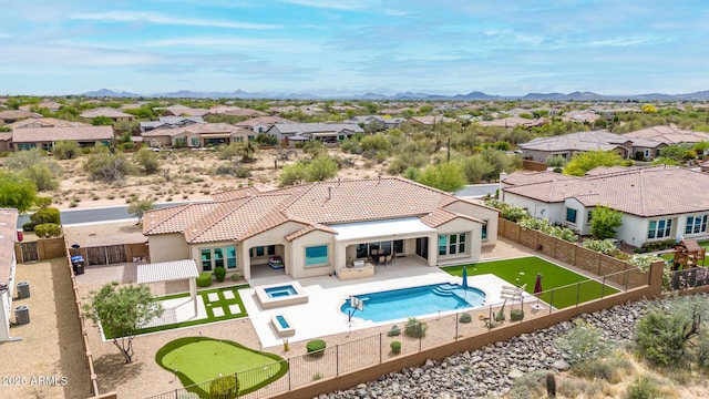 view of pool with a fenced backyard, a patio, a fenced in pool, an in ground hot tub, and a residential view