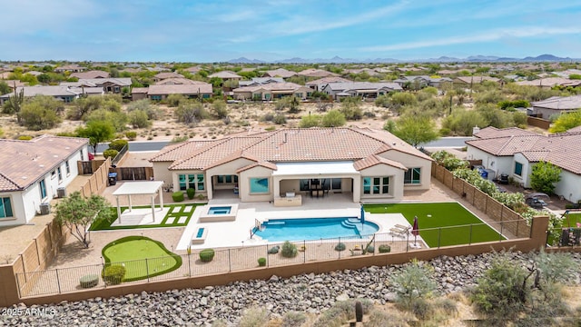 view of pool featuring a patio area, a fenced backyard, a fenced in pool, and a residential view