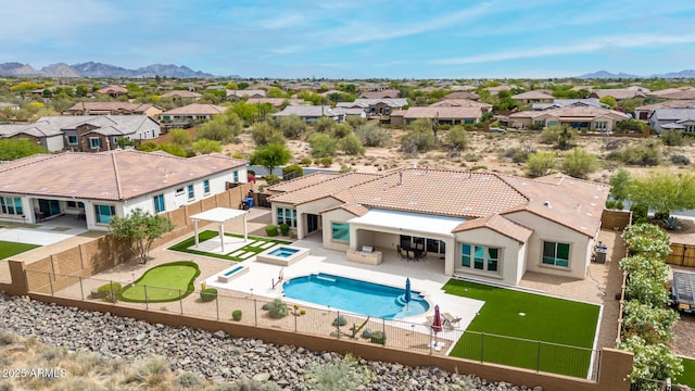 exterior space with a mountain view and a residential view