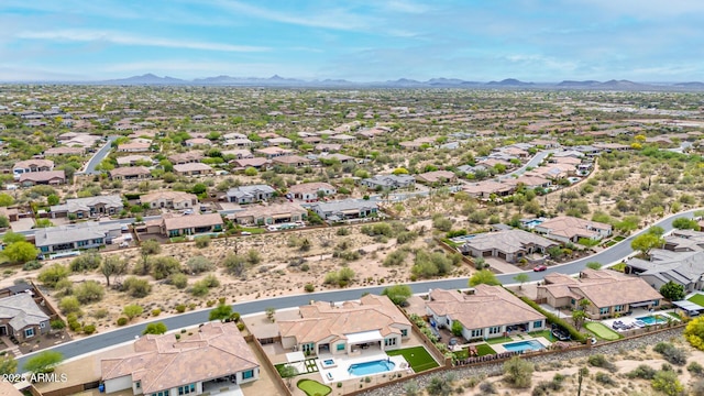 birds eye view of property with a residential view and a mountain view