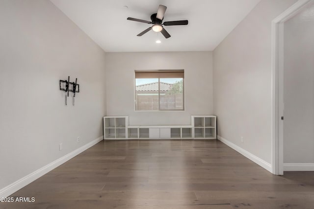 unfurnished room with recessed lighting, wood finished floors, a ceiling fan, and baseboards
