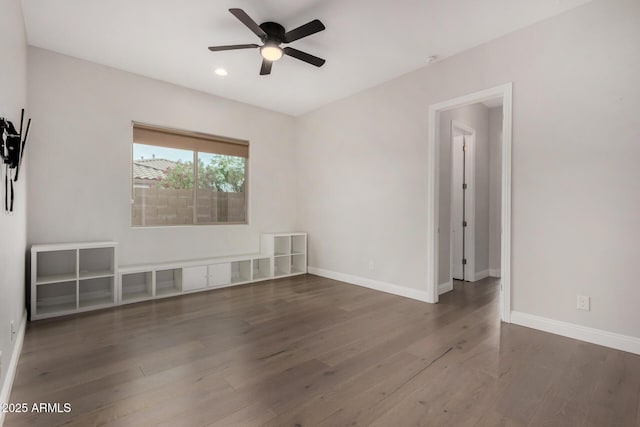 spare room with recessed lighting, wood finished floors, baseboards, and ceiling fan