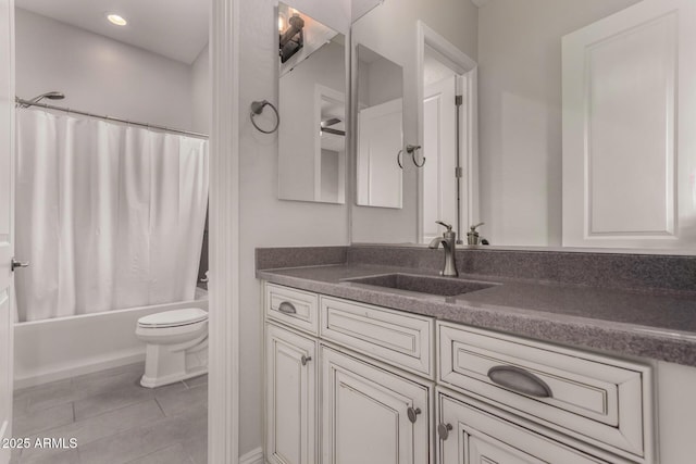full bath with shower / bath combo with shower curtain, toilet, vanity, and tile patterned floors