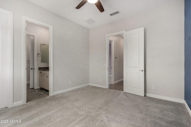 unfurnished bedroom with a ceiling fan, connected bathroom, carpet floors, baseboards, and visible vents