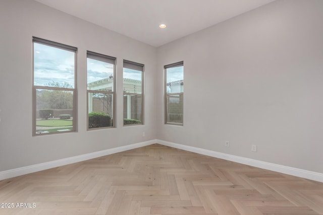 spare room featuring baseboards and recessed lighting