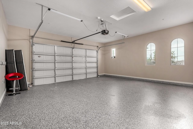 garage featuring baseboards and a garage door opener