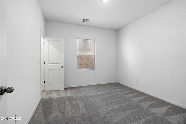 unfurnished room featuring carpet flooring