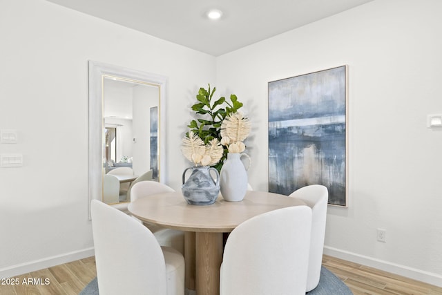 dining room with wood finished floors and baseboards