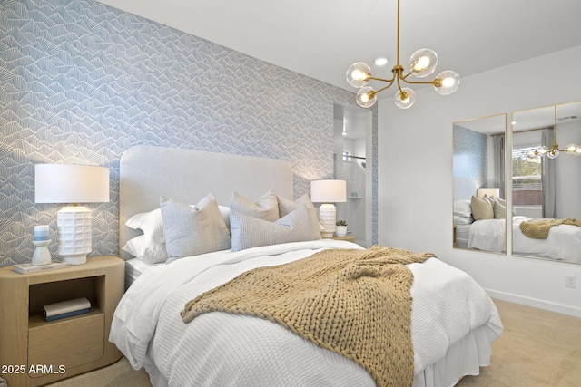 bedroom with carpet floors, an inviting chandelier, an accent wall, baseboards, and wallpapered walls