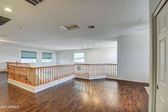 spare room with dark wood-type flooring