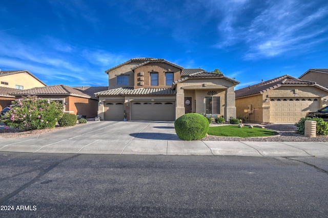 mediterranean / spanish-style house featuring a garage