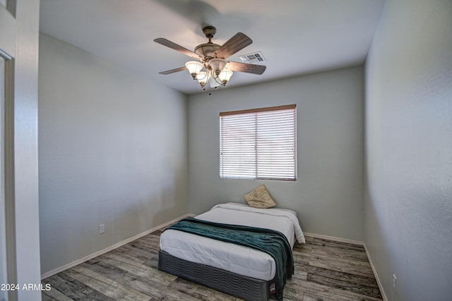 bedroom with light hardwood / wood-style floors and ceiling fan