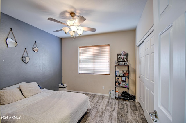 bedroom featuring a closet, ceiling fan, and light hardwood / wood-style flooring