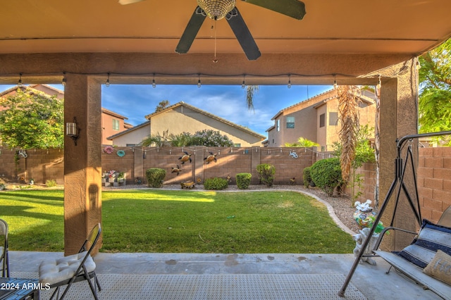 view of yard featuring ceiling fan