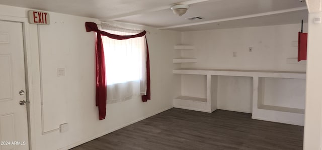 unfurnished bedroom featuring dark wood-type flooring