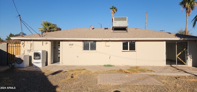 rear view of house featuring cooling unit