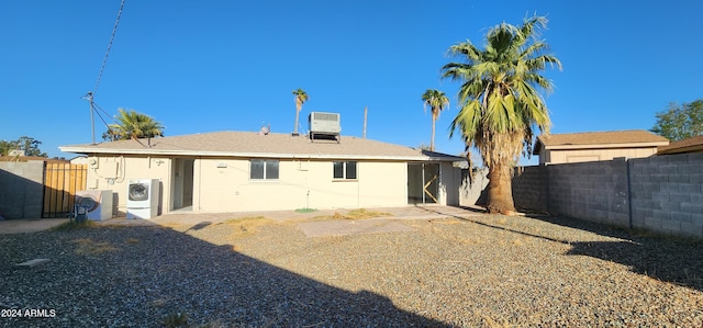 rear view of house with central air condition unit and ac unit