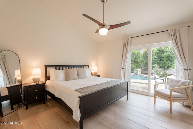 bedroom with access to exterior, light wood finished floors, lofted ceiling, and a ceiling fan