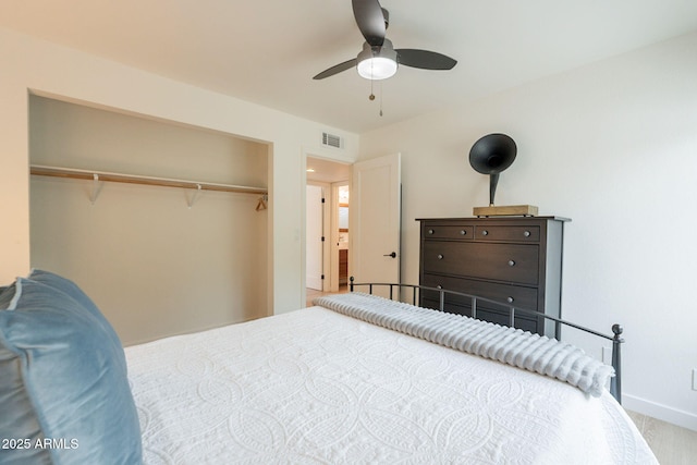 bedroom featuring a closet, a ceiling fan, and baseboards