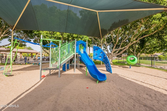 communal playground featuring fence