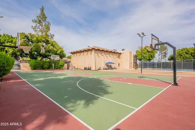 view of sport court with community basketball court and fence